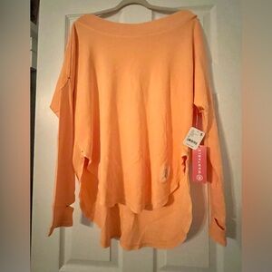 Free People FP Movement bright orange open back pullover size S - NWT new